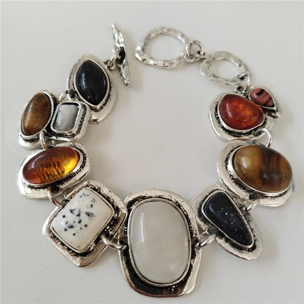 Vintage aged 925 silver bracelet with precious stones inlay.