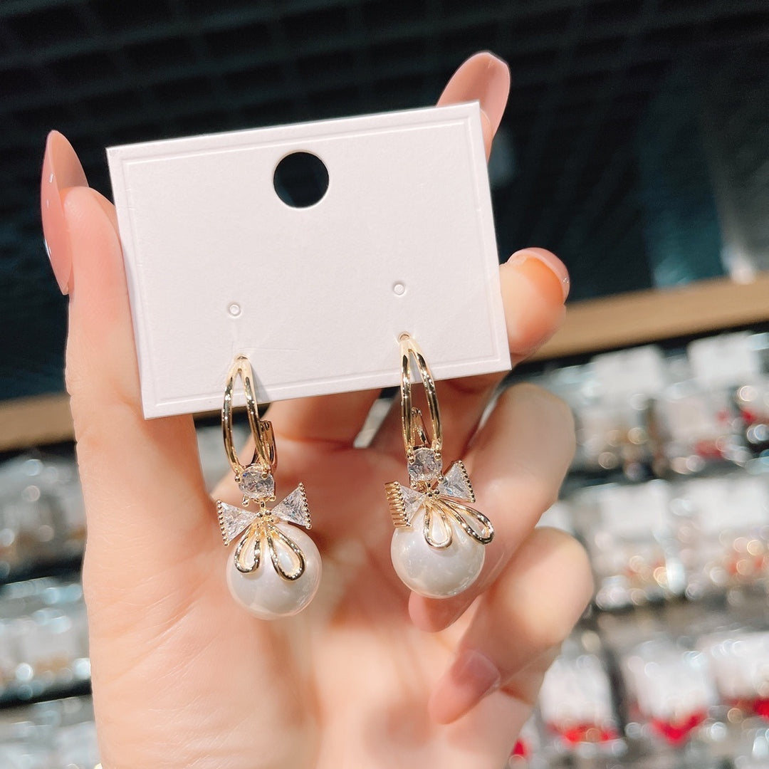 Double bow pearl earrings