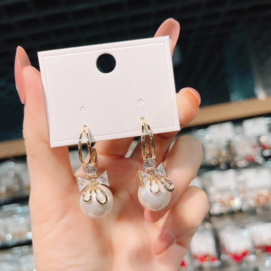 Double bow pearl earrings