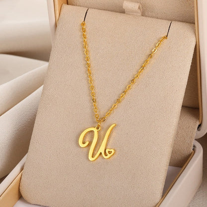 Initial pendant necklaces in cursive letter