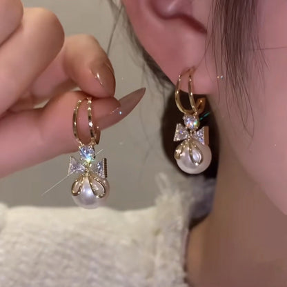 Double bow pearl earrings