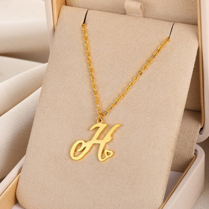 Initial pendant necklaces in cursive letter