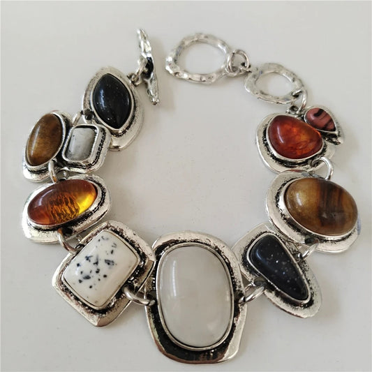 Vintage aged 925 silver bracelet with precious stones inlay.