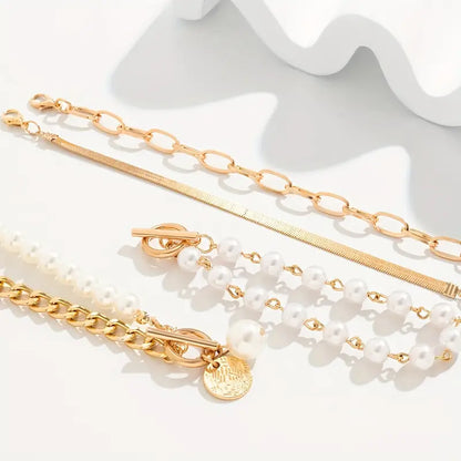 Chic Gold 4-piece Bracelet Set - Snake, Pearls and Links | Gold