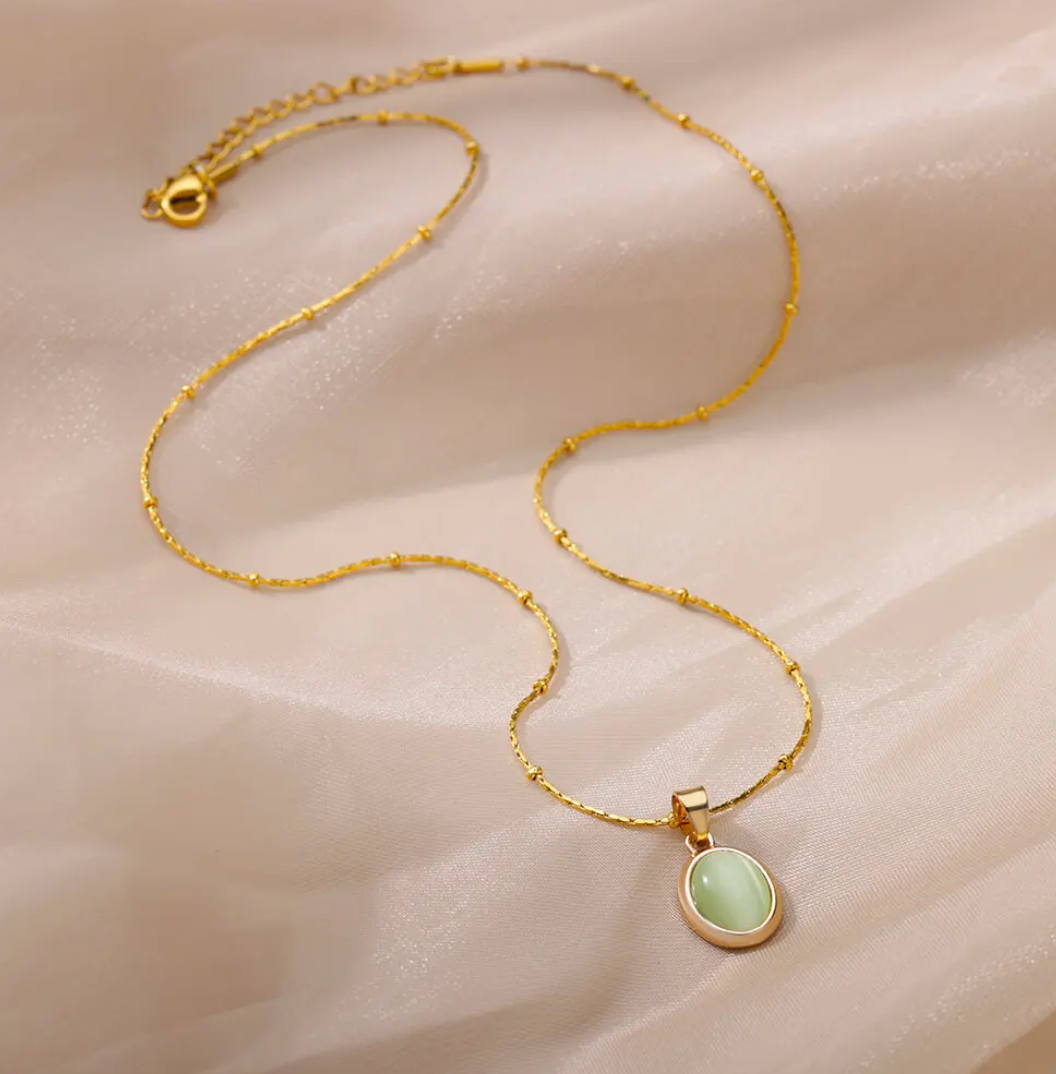 18-carat gold-plated blue crystal cross necklace