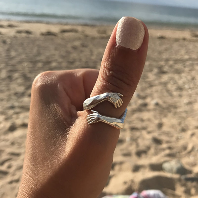 Adjustable silver hug ring