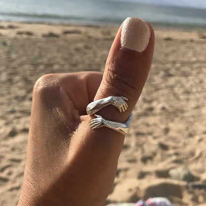 Adjustable silver hug ring