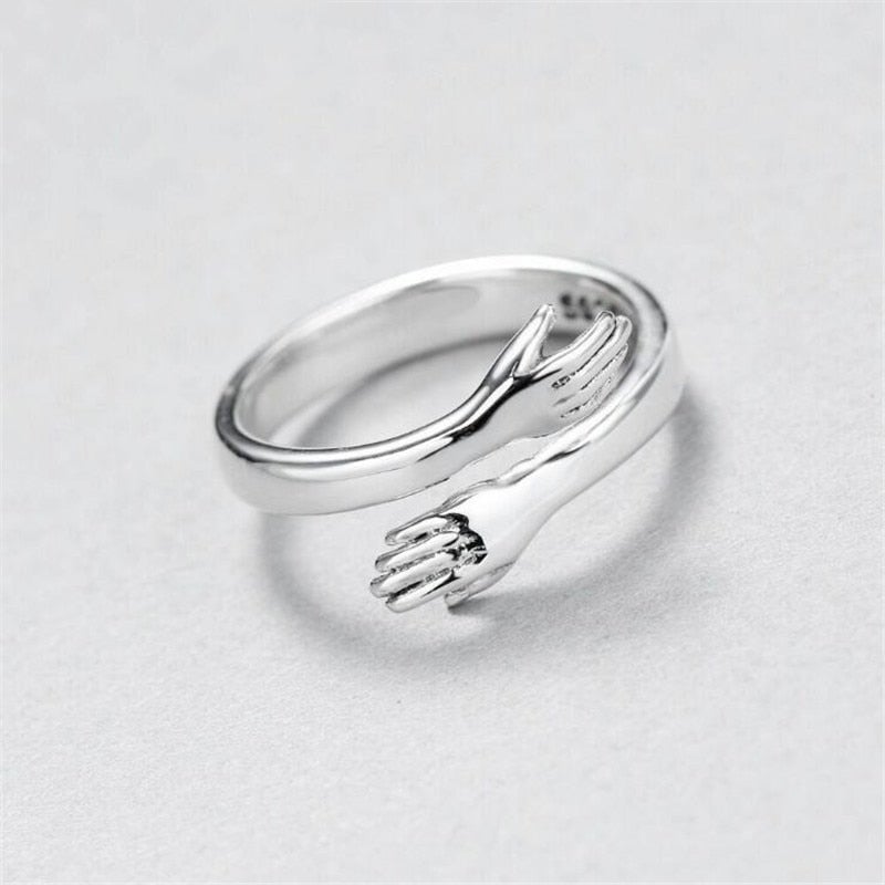 Adjustable silver hug ring