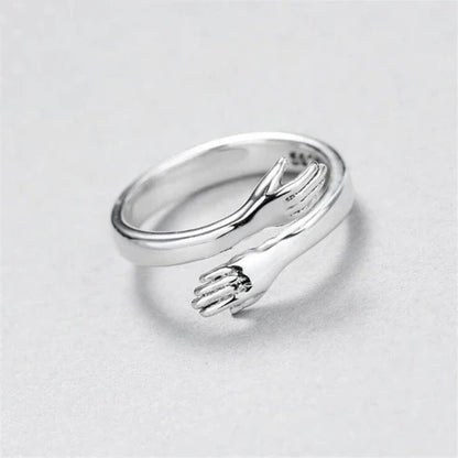 Adjustable silver hug ring