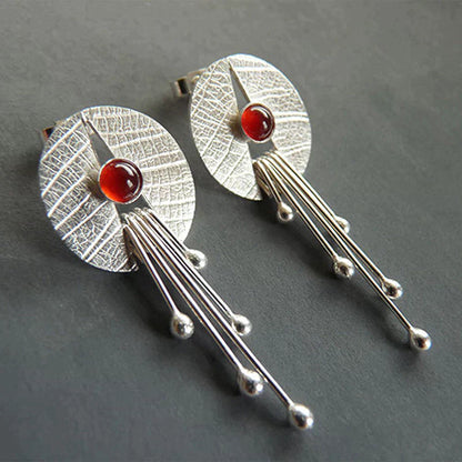 Hollow red stone drop earrings