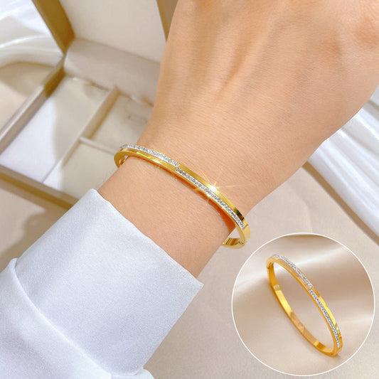 Aera golden rigid crystal bracelet