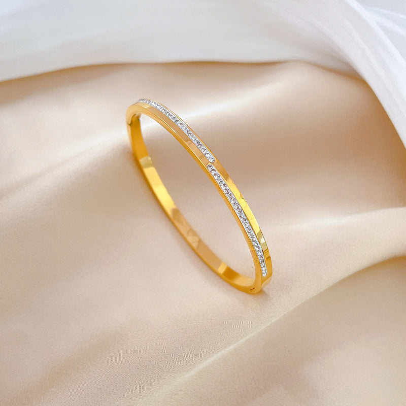 Aera golden rigid crystal bracelet
