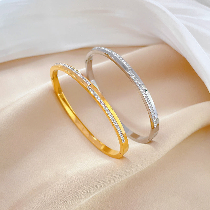 Aera golden rigid crystal bracelet