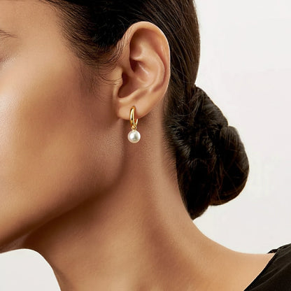 Small golden pearl earrings