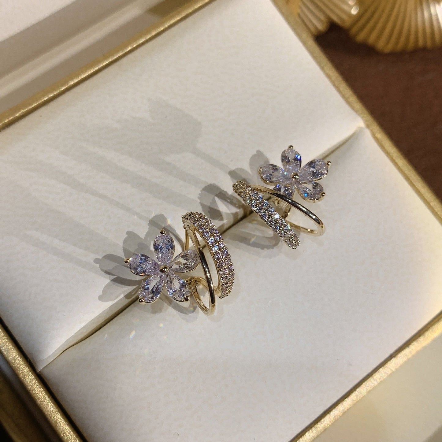 Gold floral earrings with zircon