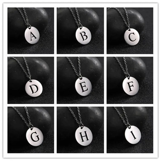 18-carat gold-plated minimalist necklace with initials engraved in a circle