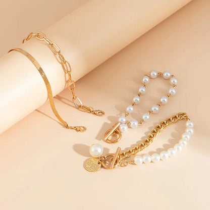 Chic Gold 4-piece Bracelet Set - Snake, Pearls and Links | Gold