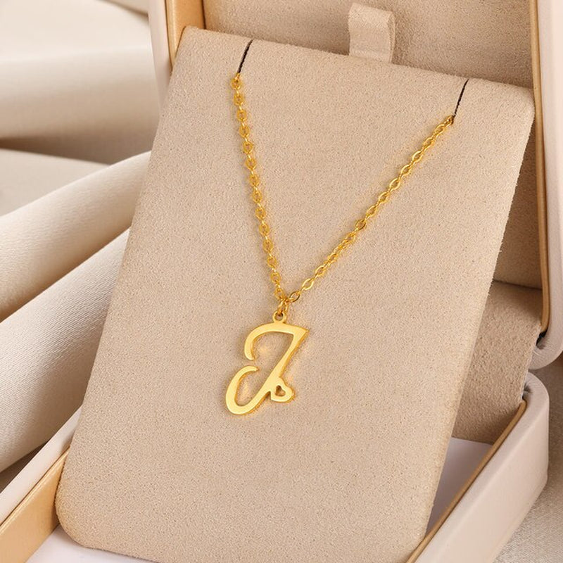 Initial pendant necklaces in cursive letter