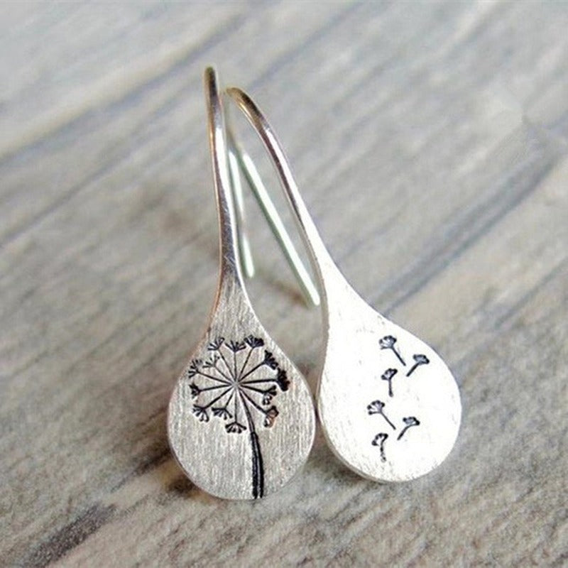 Handmade 925 sterling silver earrings composed of a flower and wind