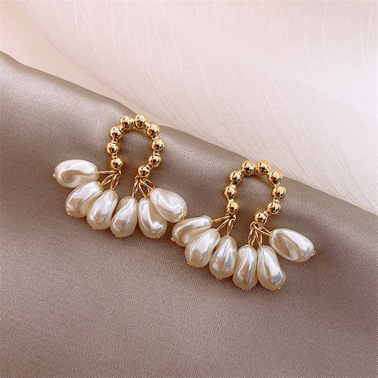 Brilliant cubic zirconia and pearl earrings