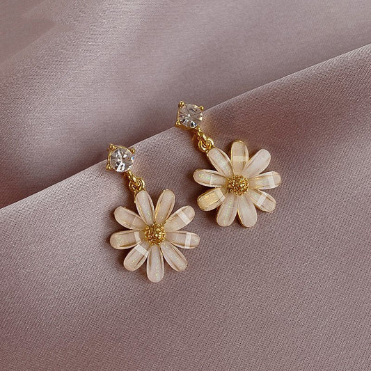 18-carat rose gold earrings with colored zircons